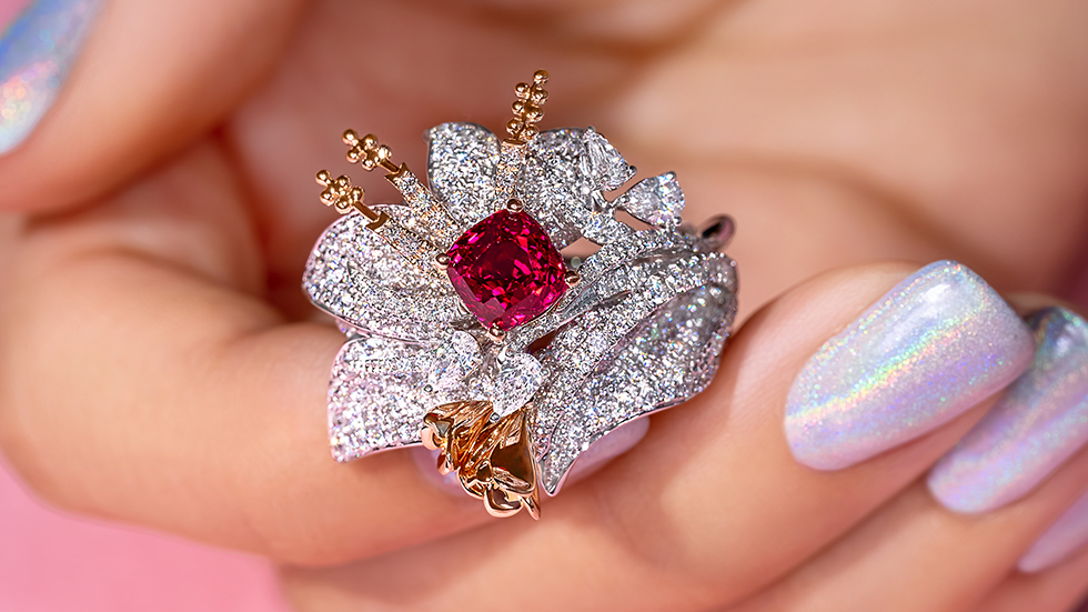 A Ruby cocktail ring with unfurling Diamond petals and movable rose-gold flower pistols. A fantasy flower inspired by her favourite plant, the Tillandsia.