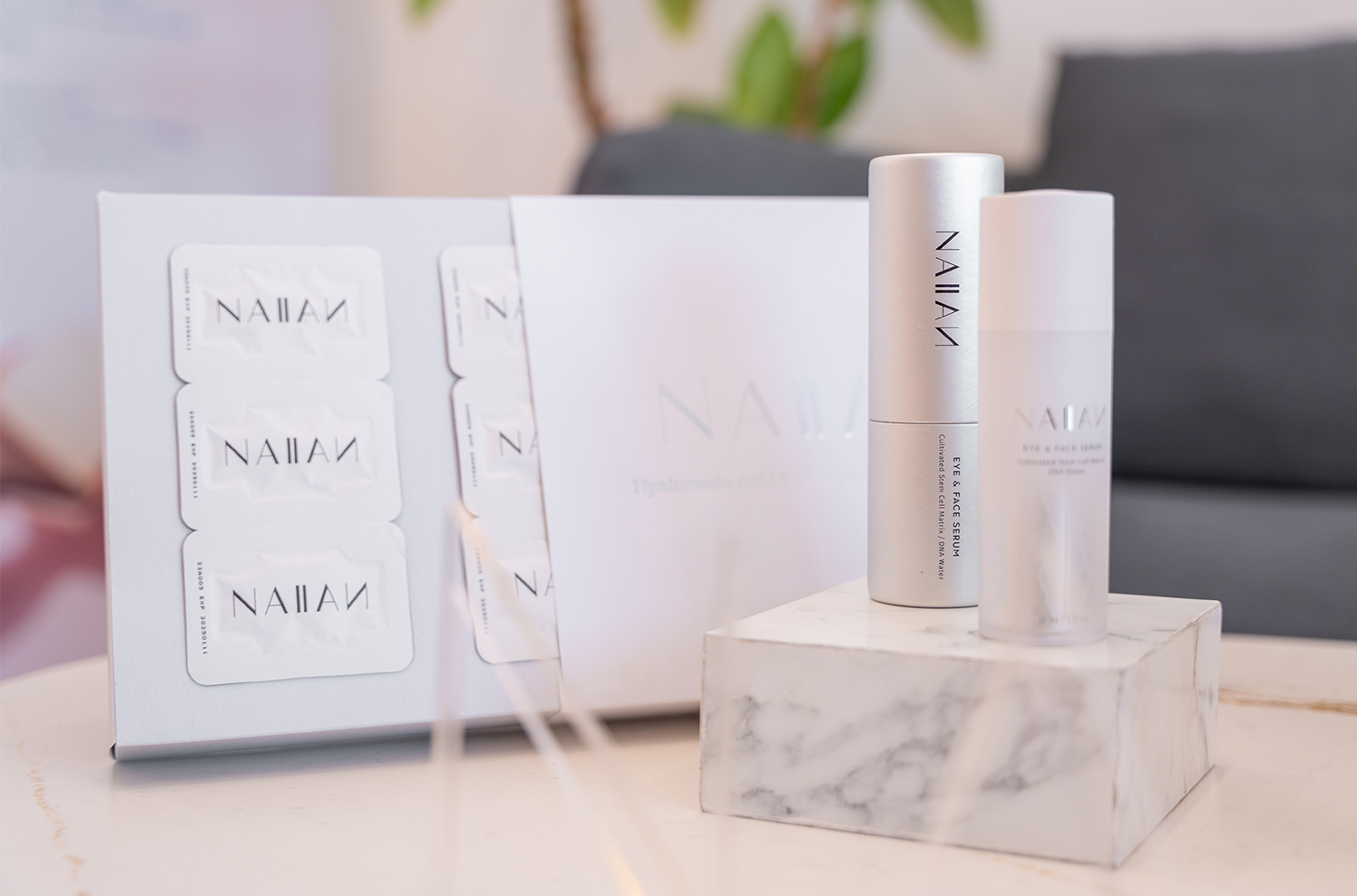 NAIIAN's signature products, Eye and Face Serum and Microneedle Rolling System.