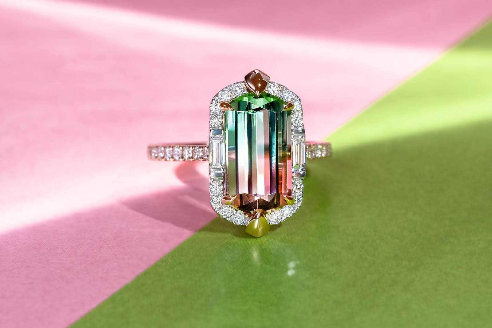 Rectangle Watermelon Tourmaline Bicolour with MADLY Diamond Halo Baguette Diamonds and Pave Band against a Pink and Green Background