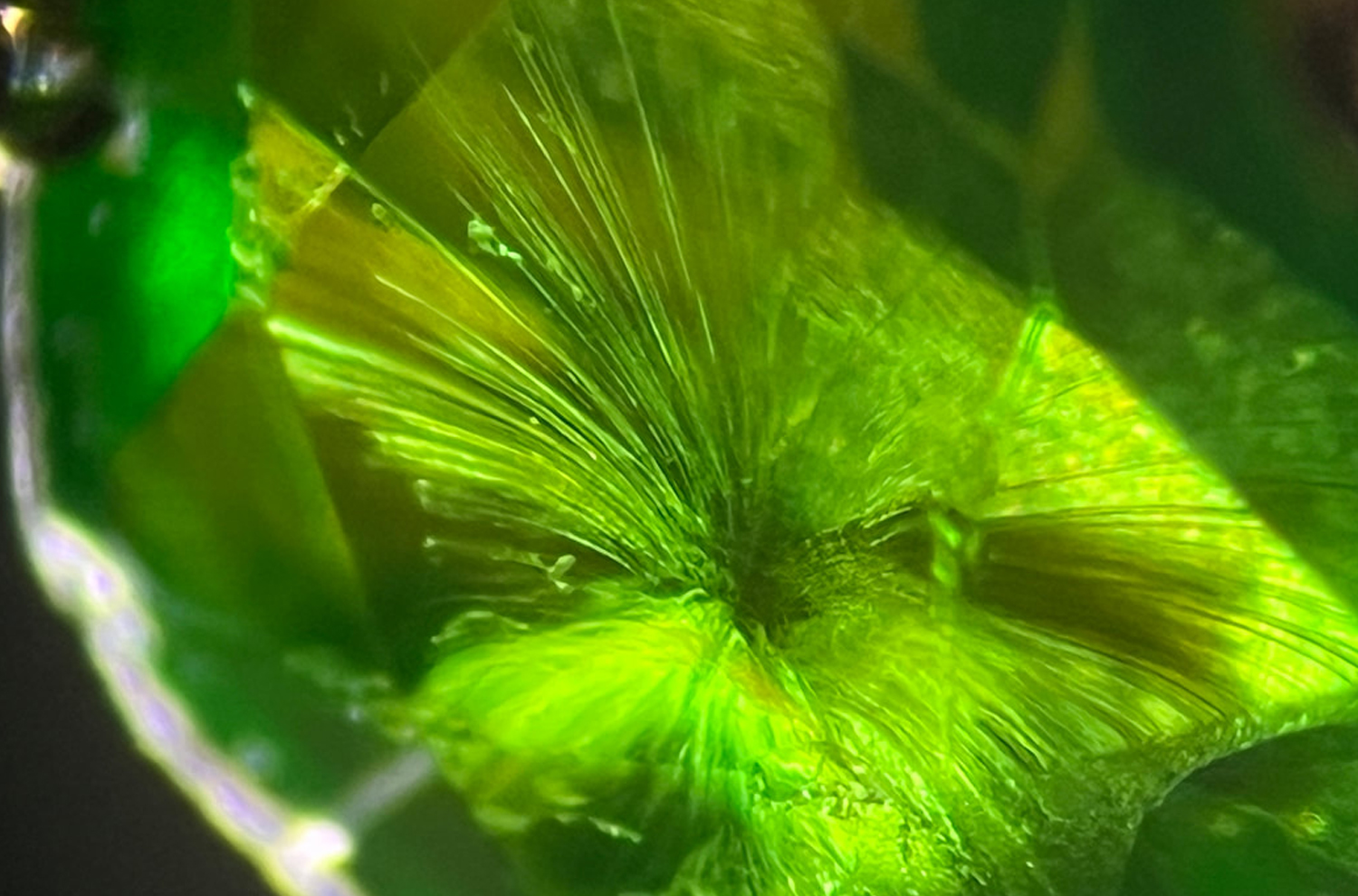 horsetail inclusions close-up in a demantoid garnet