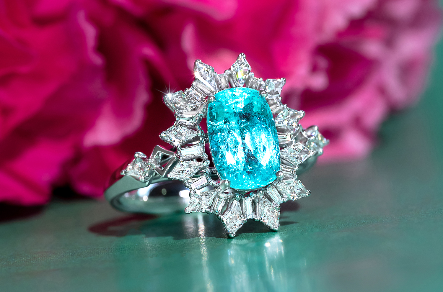 Statement Paraiba Ring with mixed-cut Diamond Halo ballerina style against green background