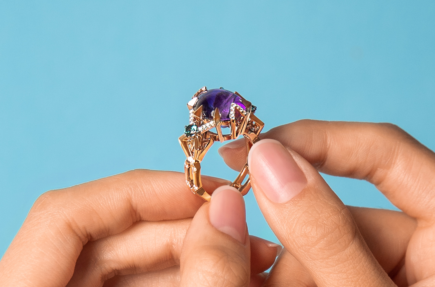 A statement ring featuring a cabochon Amethyst that was gifted by the client’s mother.