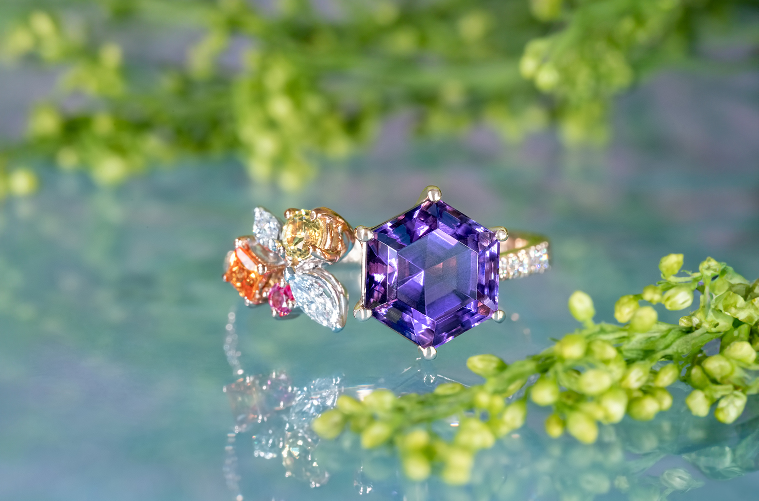 Amethysts often come in fancy shapes, like this Hexagonal Amethyst set in an open ring style accompanied by smaller and colourful setting stones.