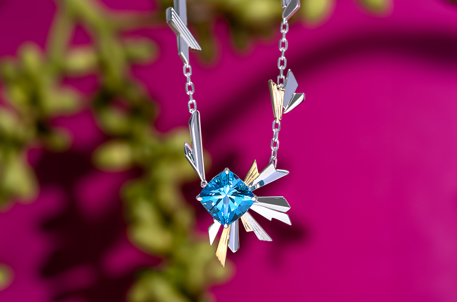 A striking and vibrant blue Topaz set in an edgy and geometric pendant.